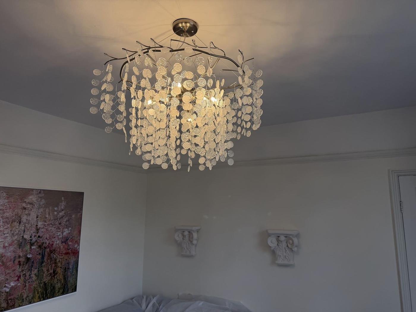 Chandelier hung and wired
