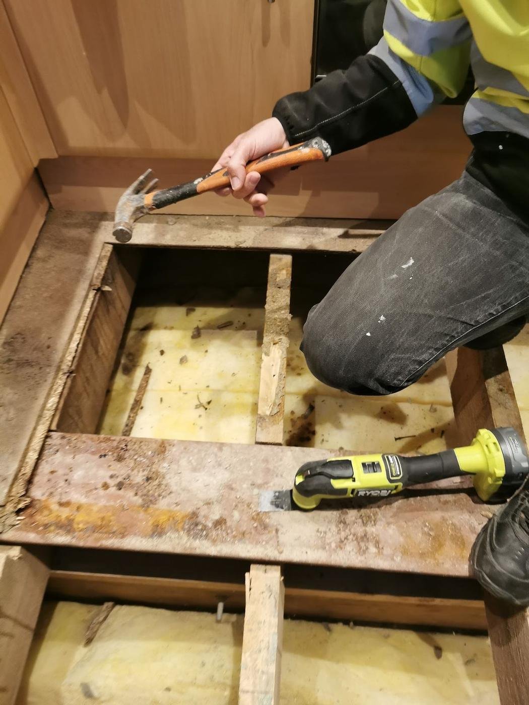 Floorboards lifted with joists showing