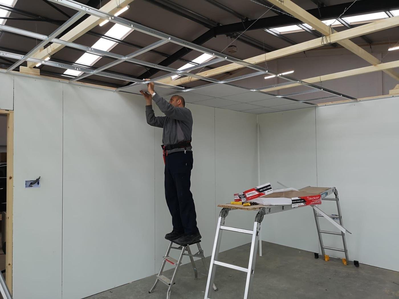 Norman fixing a ceiling grid