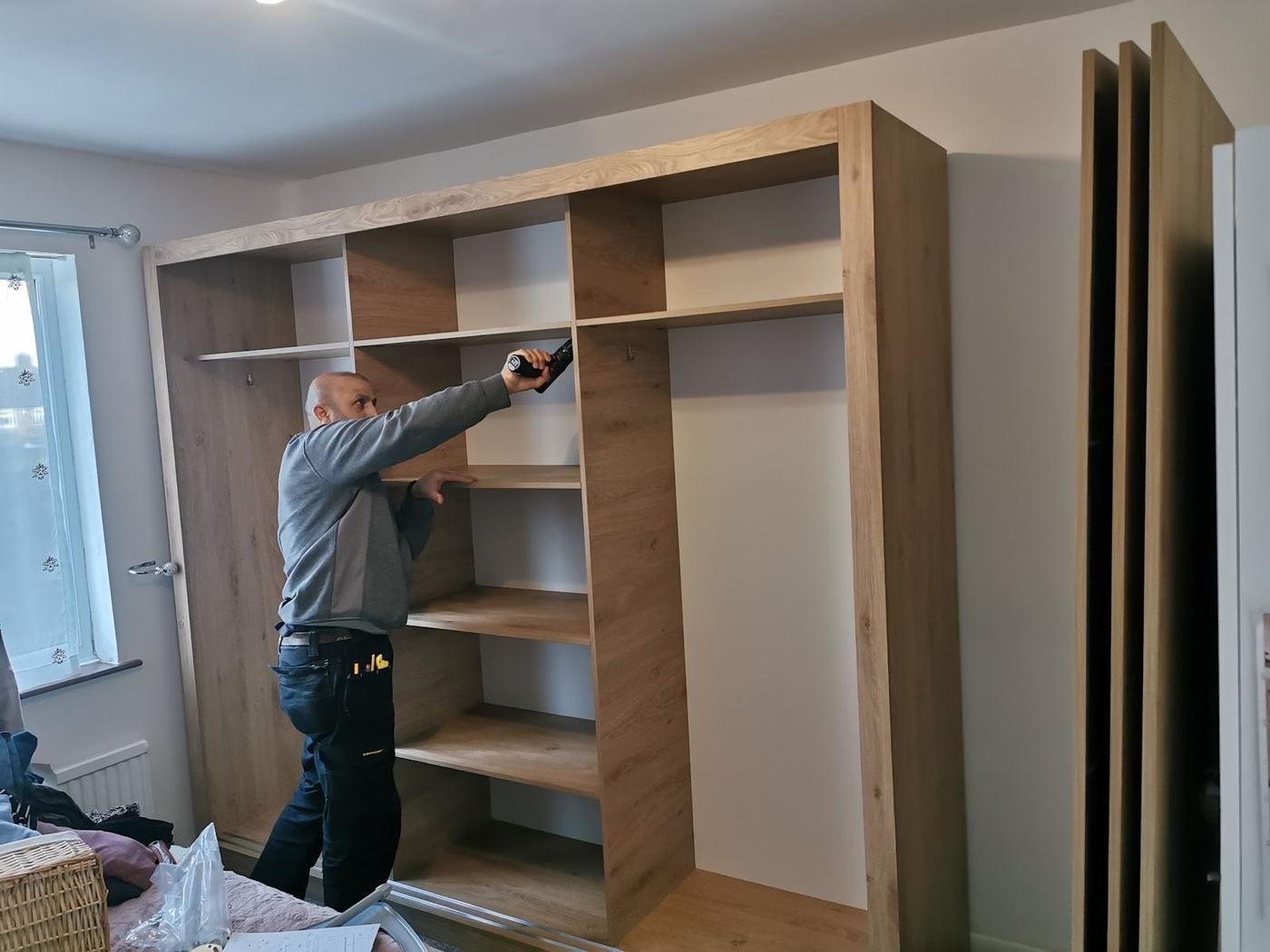 Norman building a fitted wardrobe frame