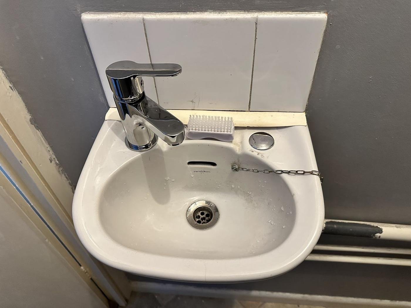 A chrome basin tap
